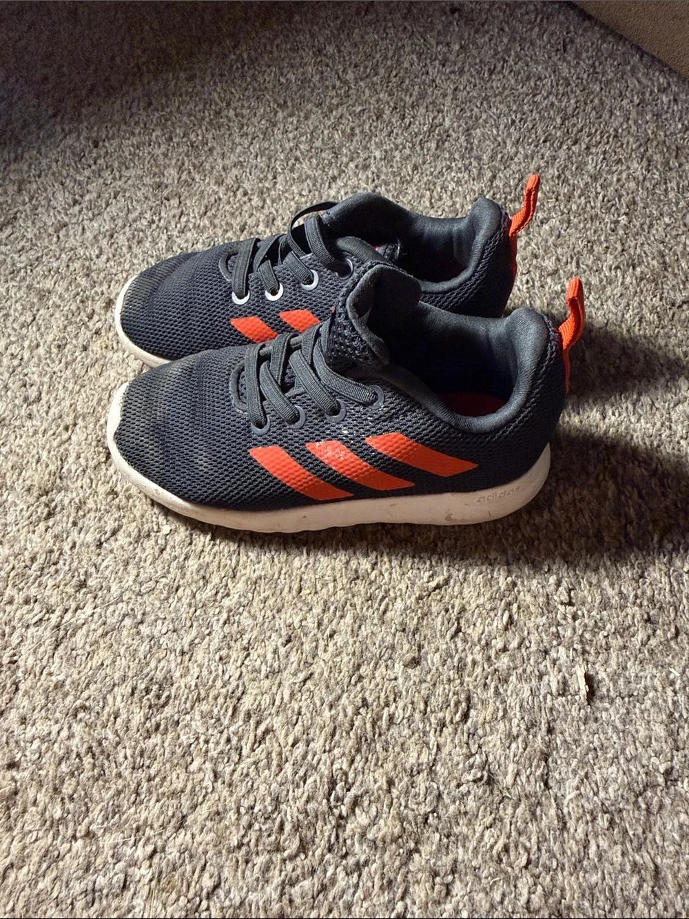 adidas Kids Black Sneakers with Orange Stripes